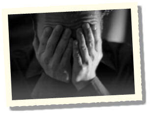 Man with head in hands